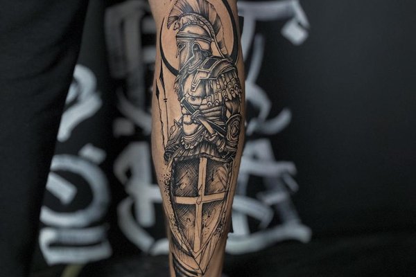 Black-and-grey warrior calf tattoo by VEAN TATTOO in Tallinn